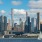 a city skyline with sailboats